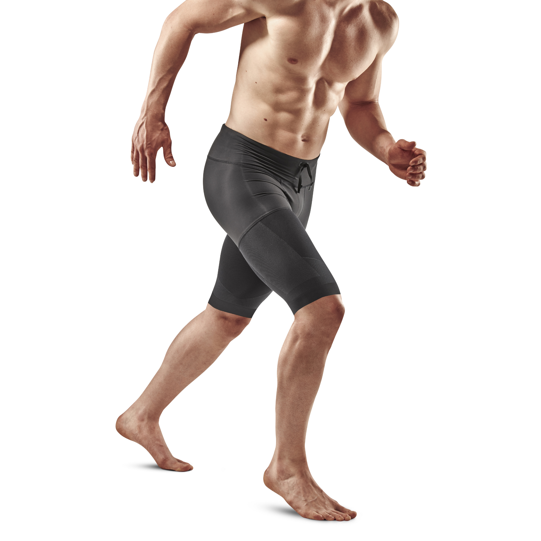 hombre en negro pantalones cortos toalla en espalda gimnasio
