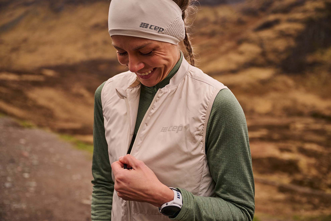 Women wearing CEP Compression Cold Weather Vest and Beanie