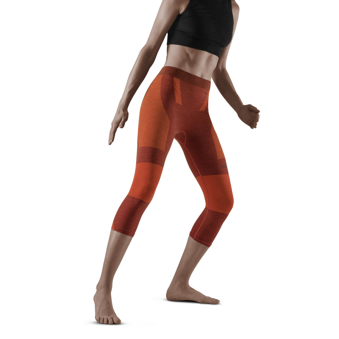 Meia-calça base 3/4 para esqui, mulher, laranja - modelo vista frontal