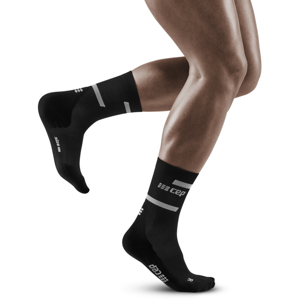 The run calcetines de compresión de corte medio 4.0, hombres, negro