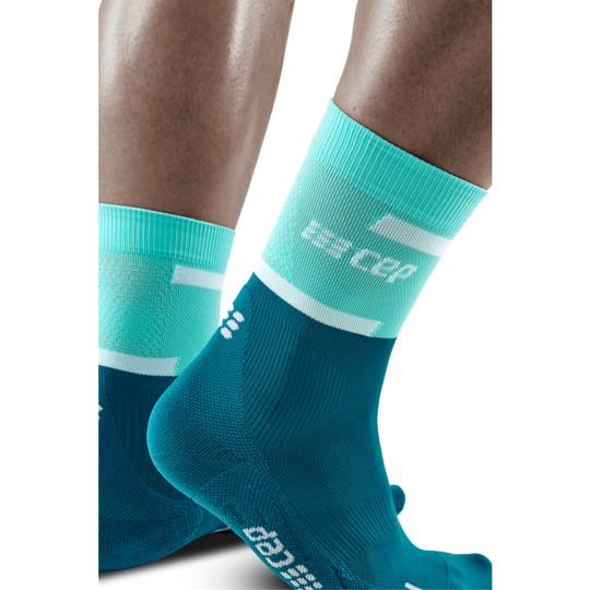 The run calcetines de compresión de corte medio 4.0, mujer, océano, detalle lateral