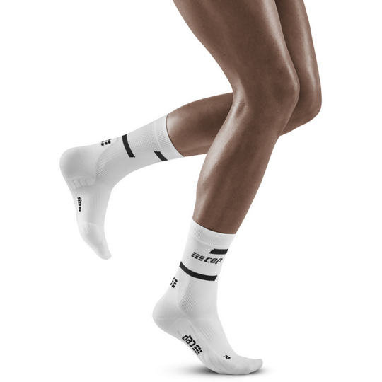 The run calcetines de compresión de corte medio 4.0, mujeres, blanco