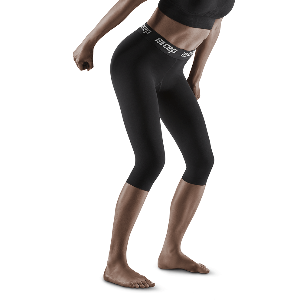 Meia-calça de compressão de esqui 3/4, mulher, preta, modelo vista frontal