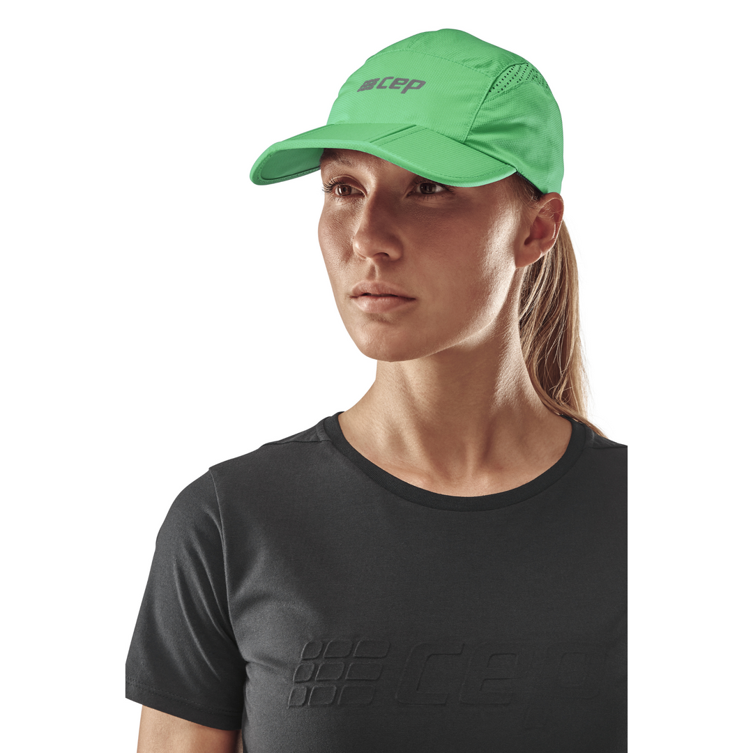 Gorra Run, verde, modelo vista frontal, mujer