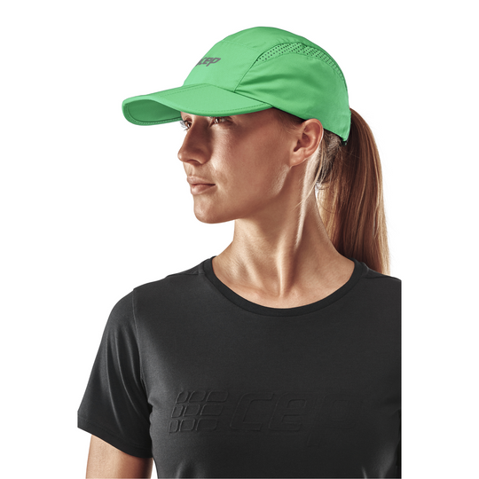 Gorra Run, verde, modelo vista lateral, mujer