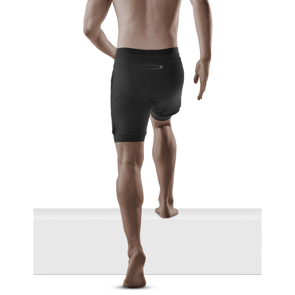pantalón corto de entrenamiento 2 en 1, hombre, negro, modelo vista trasera