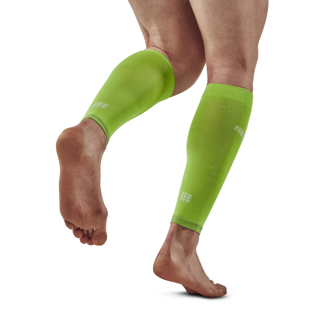 Mangas de compressão ultraleves para panturrilha, masculina, verde flash, modelo com vista traseira